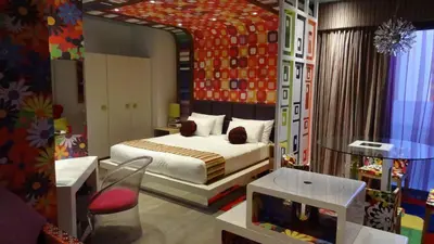 a bedroom with a bed and a tv in it at Peermont Metcourt - Thaba Moshate in Burgersfort