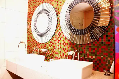 a bathroom with two sinks and a mirror at Peermont Metcourt - Thaba Moshate in Burgersfort