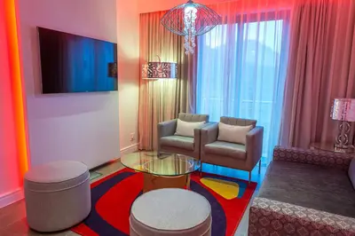 a living room with a couch and a table and chairs at Peermont Metcourt - Thaba Moshate in Burgersfort