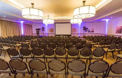 a conference room with chairs and a whiteboard at The Centurion Hotel in Centurion