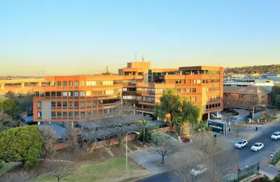 an overhead view of a city with buildings and a street at The Centurion Hotel in Centurion