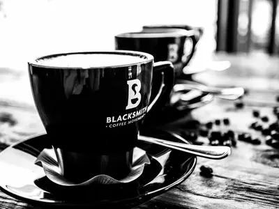 two coffee cups are sitting on a table at Rustique Boutique Hotel in Middelburg