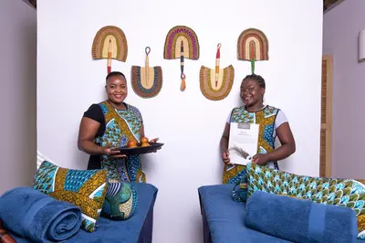 two women standing in a room with a plate of food at Unembeza Boutique Lodge & Spa in Hoedspruit