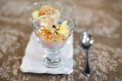 a dessert in a glass on a napkin with a spoon at The Village in Hatfield in Pretoria