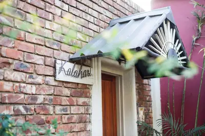 a sign on the side of a brick building at The Village in Hatfield in Pretoria