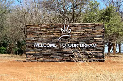 a sign that says welcome to our dream at Re a Lora Lodge in Bela-Bela