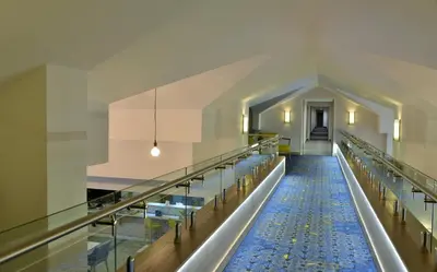 a long aisle of a church with rows of benches at Town Lodge Menlo Park in Pretoria