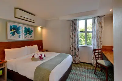 a hotel room with a bed and a window at Town Lodge Waterfall, Midrand in Midrand