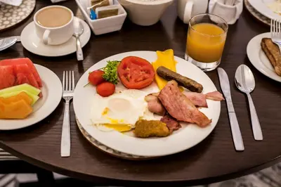 a plate of breakfast food on a table at Town Lodge Polokwane in Polokwane