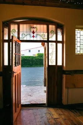 an open door with a view of the water at The Grey's Inn in Machadodorp