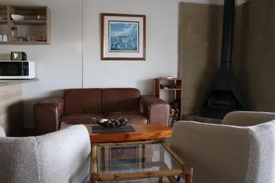 a living room with a couch and a coffee table at The Stix in Dullstroom