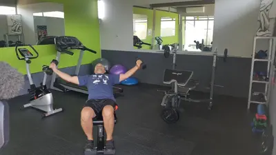 a man exercising in a gym on a exercise bike at Chill Pepper Boutique Hotel in Nelspruit