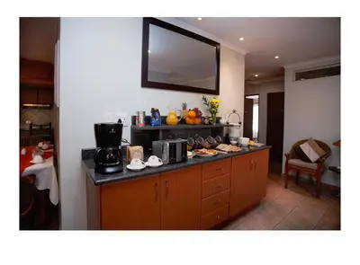 a kitchen with a counter with food on it at The Monte Carlo in Centurion