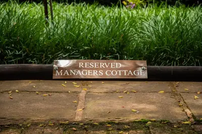 a sign for a reserved managerorersuddle on a park bench at Critchley Hackle - Managers Cottage in Dullstroom