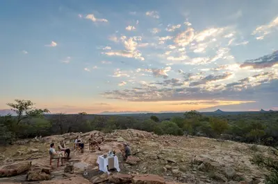 a group of people standing on top of a mountain at Rukiya Safari Camp in Hoedspruit