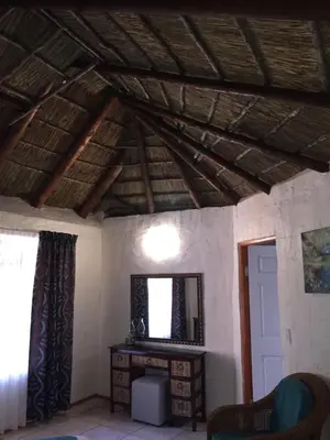 a room with a wooden ceiling and a mirror at ConcordiaVOC in Lanseria