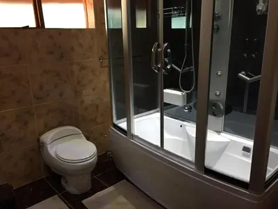a bathroom with a toilet and a shower and a sink at ConcordiaVOC in Lanseria