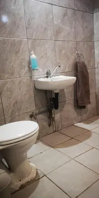 a bathroom with a toilet and a sink at ConcordiaVOC in Lanseria