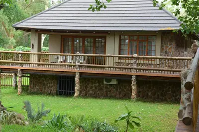 a house with a deck in the yard at Stoep At Steenbok Self Catering in Komatipoort