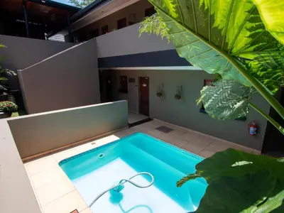 a swimming pool in the middle of a house at Casa Albergo Corporate Guest House in Pretoria