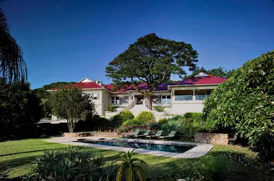a house with a swimming pool in the yard at umSisi House in White River