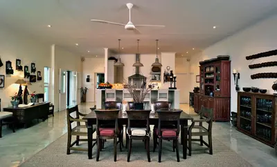 a dining room with a table and chairs at umSisi House in White River