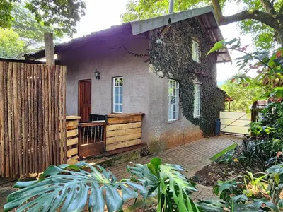 a house with ivy growing on the side of it at Softwaters Guesthouse Cottages in Louis Trichardt