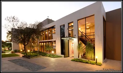 a large building with lights on the side of it at The Lakes Boutique Lodge in Pretoria