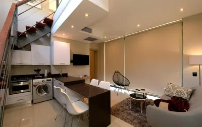 a kitchen and living room with a dining room at The Lakes Boutique Lodge in Pretoria