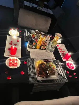 a table with several plates of food on it at Pari Guest House in Middelburg