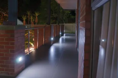 a hallway with lights on the side of a building at Hudson House in Pretoria