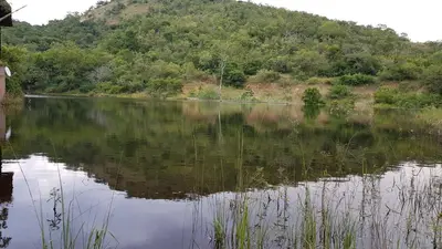 a view of a lake with a mountain in the background at Sunset Creek Game Lodge in Karino