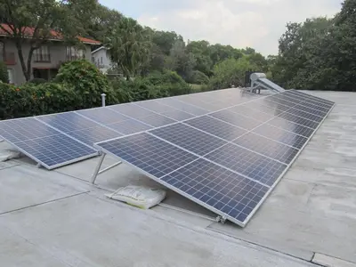 a group of solar panels on top of a roof at House Sandrock Muckleneuk Selfcatering apartment in Pretoria