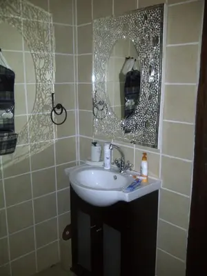 a bathroom with a sink and a mirror at 42onKing in Centurion