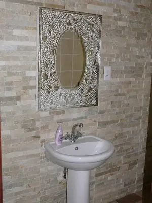 a bathroom with a sink and a mirror at 42onKing in Centurion