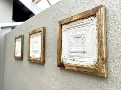 two framed pictures on the side of a wall at Willows Garden Cottage in Pretoria