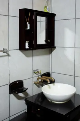 a bathroom with a sink and a bowl on a counter at Riverman Cabin Country Lodge - Tonteldoos in Tonteldoos