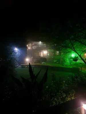 a house at night with lights in the yard at Kattekwaad Accommodation in Kaapsehoop