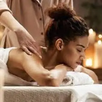 a woman sitting in a tub getting a massage at Mingwe Private Game Lodge in Mabula