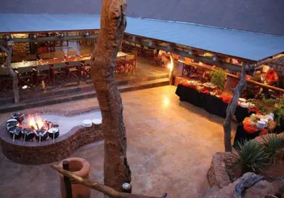 an aerial view of a restaurant with a fire pit at Mingwe Private Game Lodge in Mabula