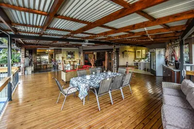 a dining room with a table and chairs at The Rest Guest House in Nelspruit