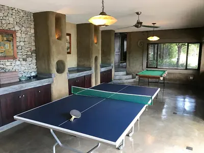 a room with a ping pong table in it at Tinkers Lakeside Lodge - Kruger in White River