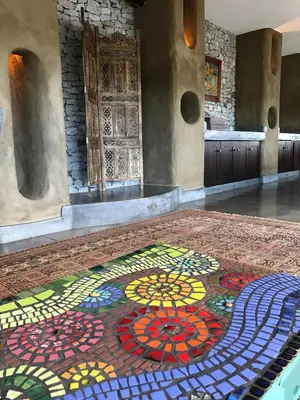 a mosaic floor in a room with a door at Tinkers Lakeside Lodge - Kruger in White River