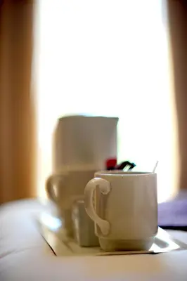 a group of coffee cups sitting on a table at Villa Paradiso in Hartbeespoort