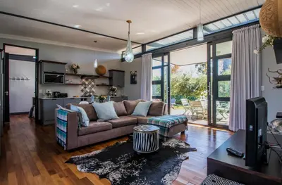 a living room with a couch and a table at Wolf Unit in Pretoria