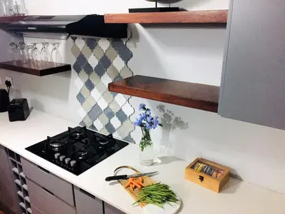 a kitchen counter with a stove and a vase of flowers at Wolf Unit in Pretoria
