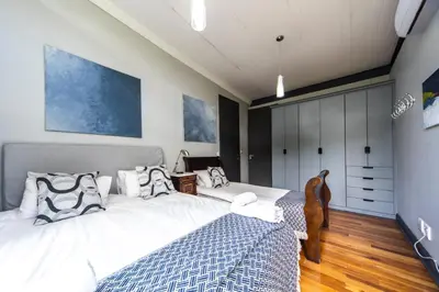a bedroom with two twin beds in a room at Wolf Unit in Pretoria