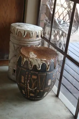 a wooden barrel sitting next to a window at Villa ZaZu in Marloth Park