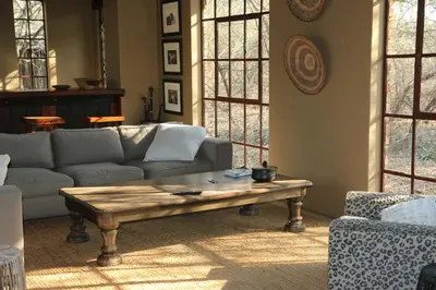 a living room with a couch and a coffee table at Villa ZaZu in Marloth Park