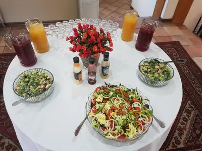 a table with three plates of food and drinks at Cornerstone Guest Lodge in Pretoria
